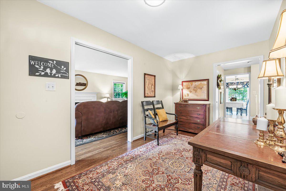 9809 Canal Road Gaithersburg, MD 20886 - Photo 4 of 50 a bedroom with furniture and a wooden floor