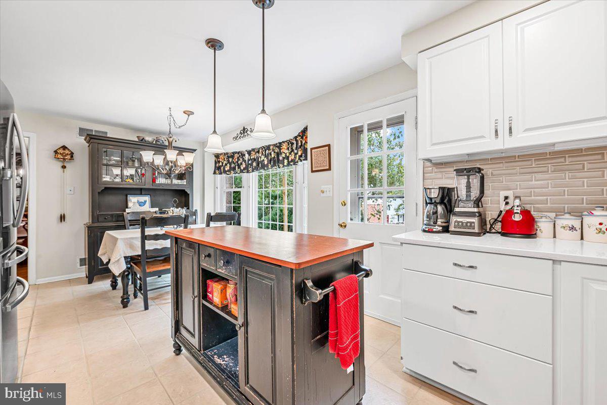 9809 Canal Road Gaithersburg, MD 20886 - Photo 8 of 50 a kitchen with stainless steel appliances granite countertop a stove and a wooden floors
