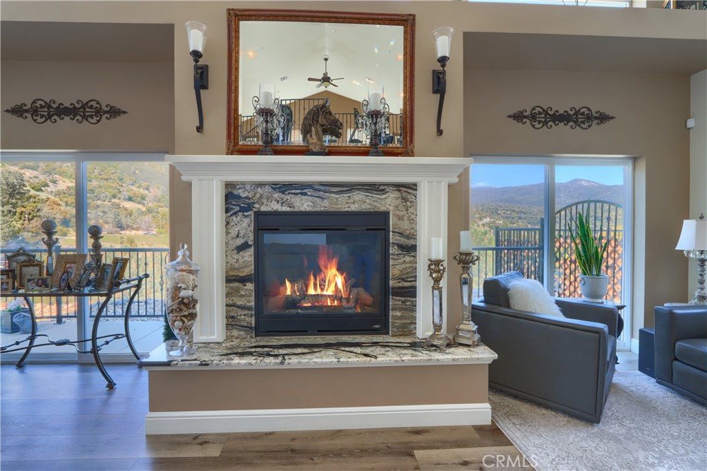 42038 Empty Creek Road Oakhurst, CA 93644 - Photo 4 of 66 propane fireplace, sliders lead to side and back yard fenced area