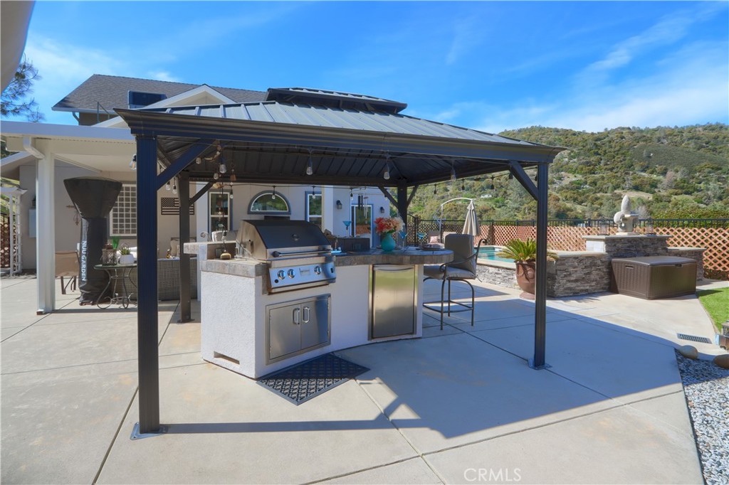 42038 Empty Creek Road Oakhurst, CA 93644 - Photo 44 of 66 outdoor covered kitchen area