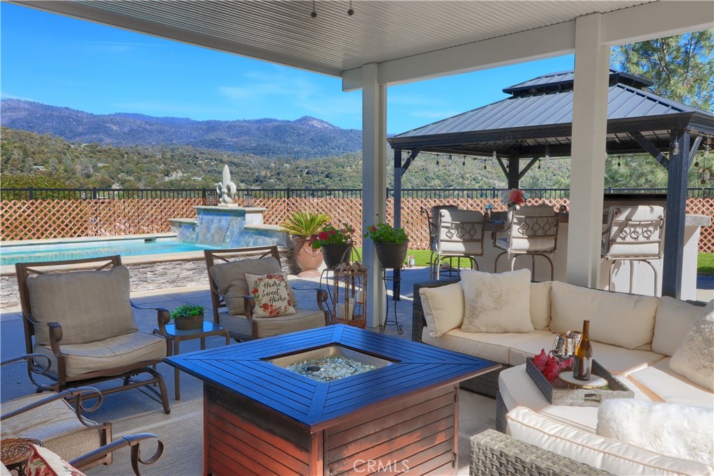 42038 Empty Creek Road Oakhurst, CA 93644 - Photo 45 of 66 built in awning seating area