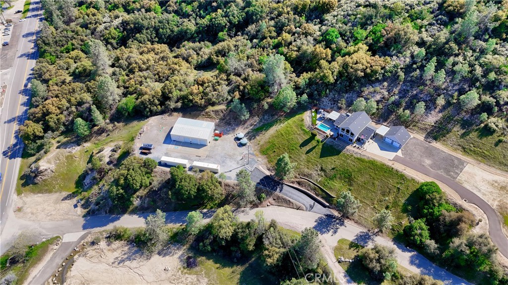 42038 Empty Creek Road Oakhurst, CA 93644 - Photo 54 of 66 aerial shot of 2400+_ shop with separate driveway entrance