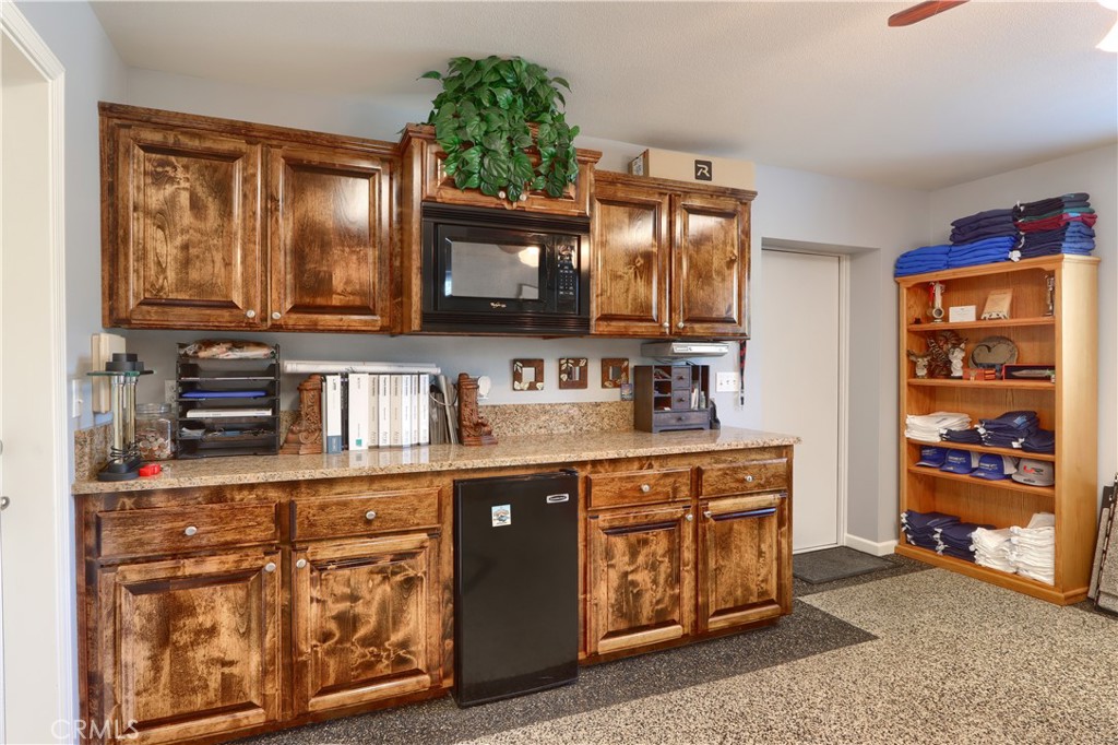 42038 Empty Creek Road Oakhurst, CA 93644 - Photo 62 of 66 built in cabinetry in shop