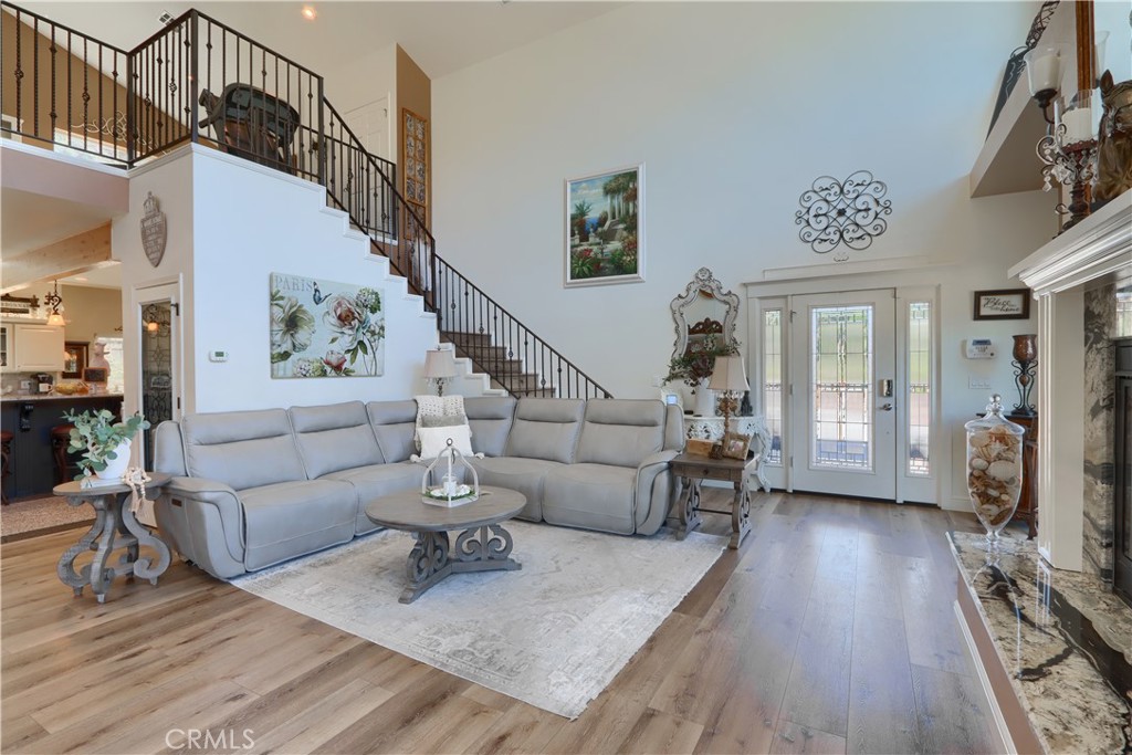 42038 Empty Creek Road Oakhurst, CA 93644 - Photo 9 of 66 Custom wrought iron work stairs and loft, hardwood flooring