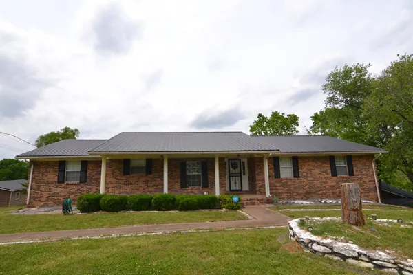 front view of a house with a yard