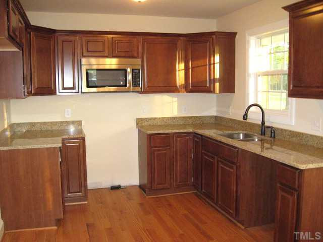 5596 Brogden Road Smithfield, NC 27577 - Photo 2 of 12 Beautiful kitchen with granite counters, stainless steel appliances, & new cabinets Kitchen