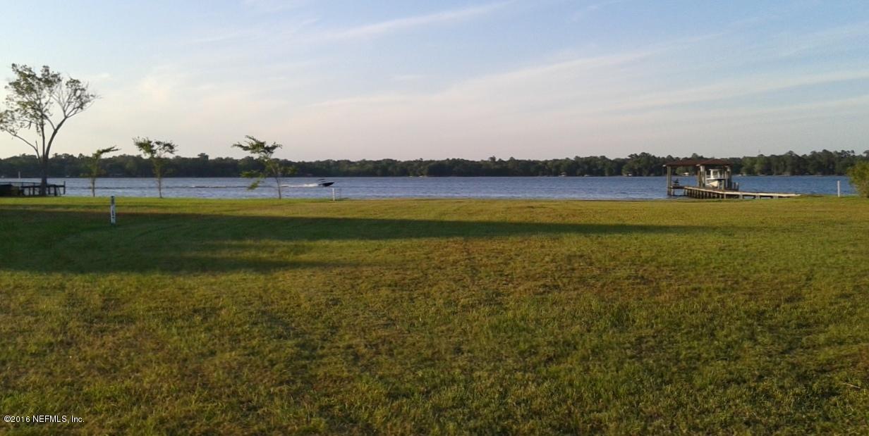 2128 Romeo Point Lane Fleming Island, FL 32003 - Photo 1 of 4 a view of a lake and a yard