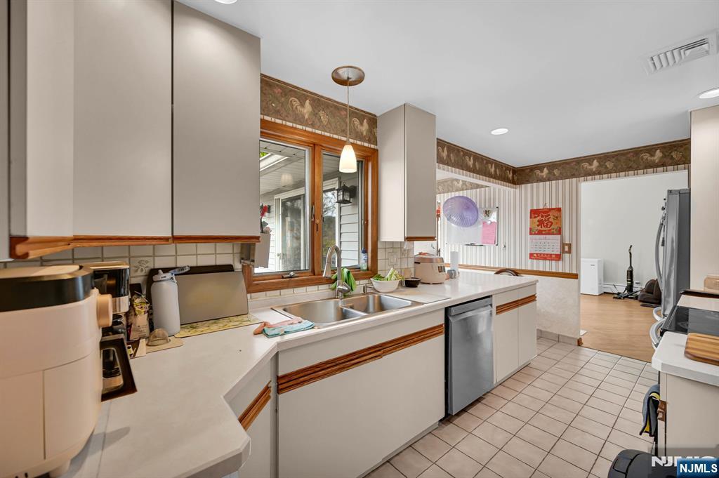 699 Shore Road West Milford, NJ 07421 - Photo 22 of 50 a large white kitchen with a large window and sink