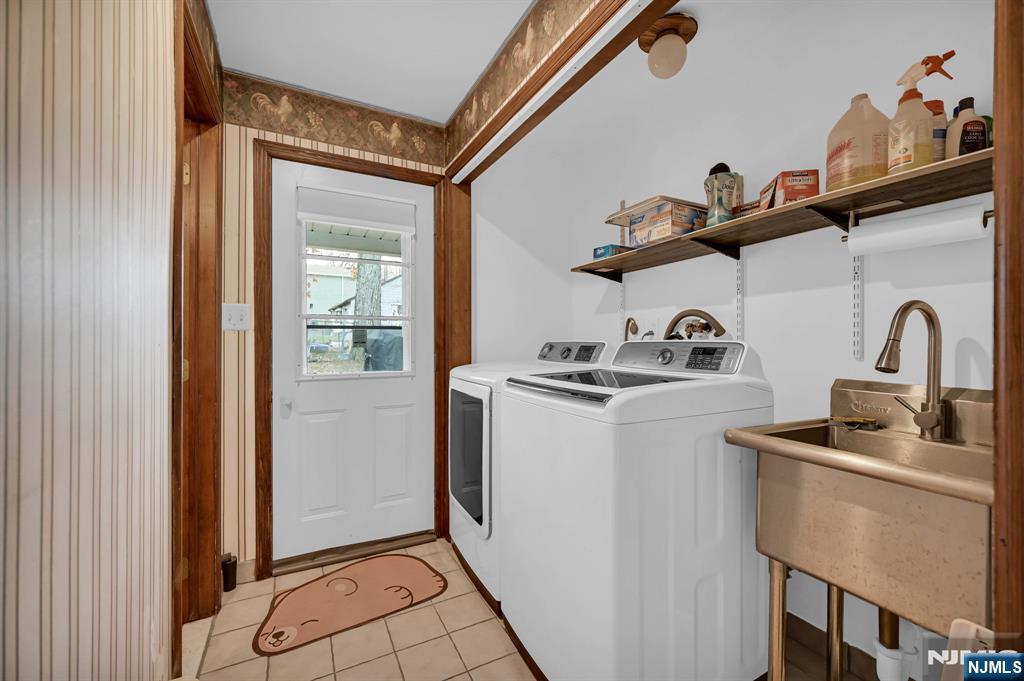 699 Shore Road West Milford, NJ 07421 - Photo 24 of 50 a kitchen with a refrigerator and cabinets