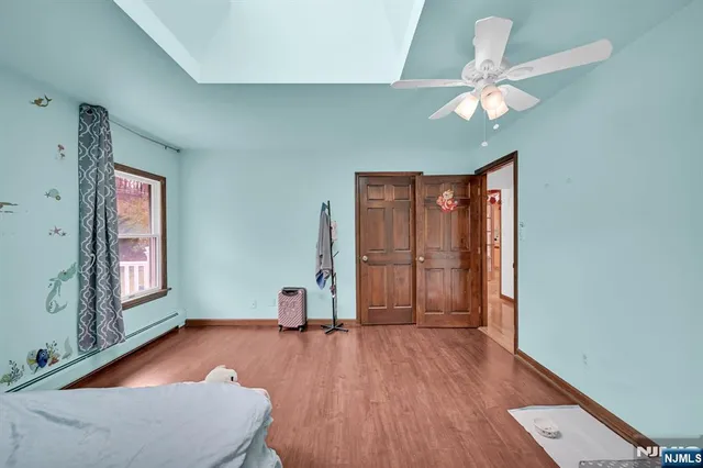 a view of livingroom with hardwood floor and ceiling fan