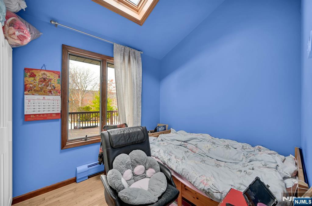 699 Shore Road West Milford, NJ 07421 - Photo 34 of 50 a bedroom with a bed and a window