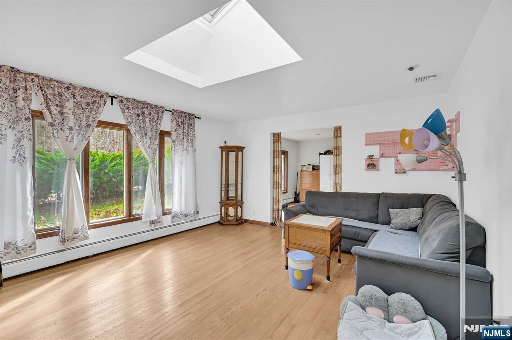 699 Shore Road West Milford, NJ 07421 - Photo 4 of 50 a living room with furniture and a large window