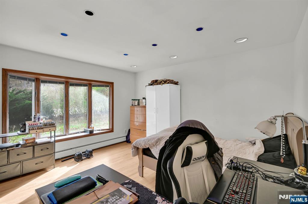 699 Shore Road West Milford, NJ 07421 - Photo 9 of 50 a view of a living room with furniture and floor to ceiling window