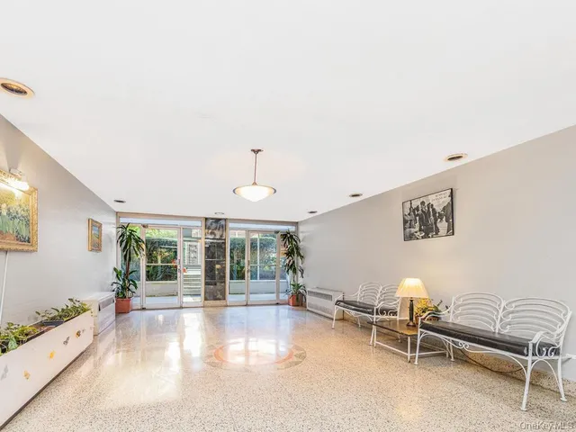 a view of livingroom with furniture and floor to ceiling window
