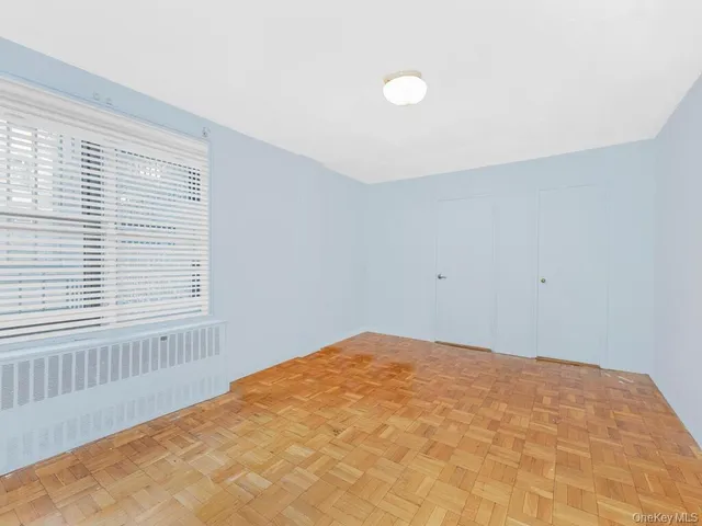 a view of an empty room with a window