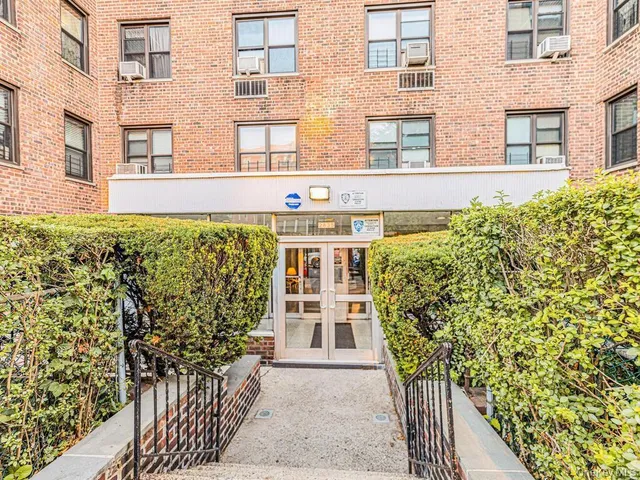 a front view of a building with large windows