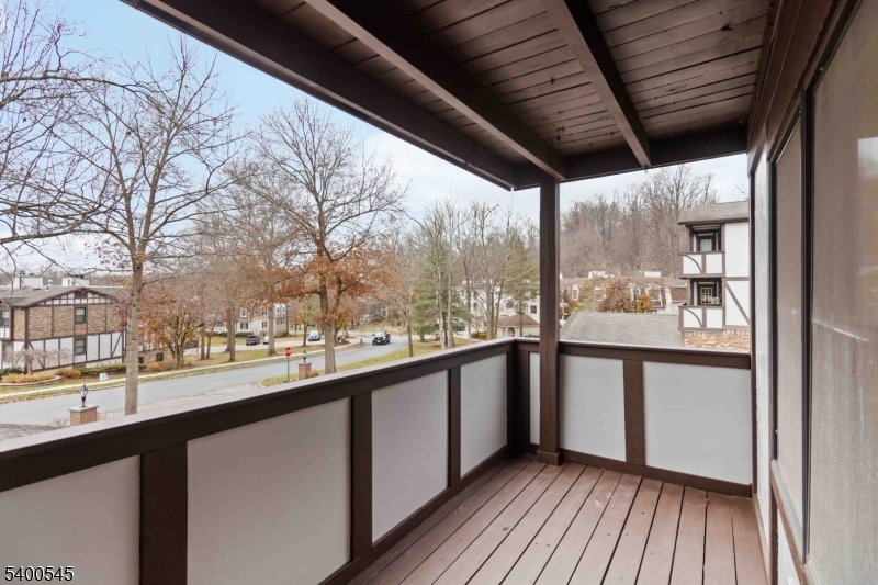 22 Heritage Drive, Unit C Chatham, NJ 07928 - Photo 20 of 27 a view of a city from a balcony