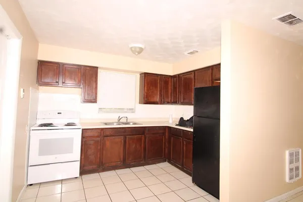 a kitchen with a sink and cabinets