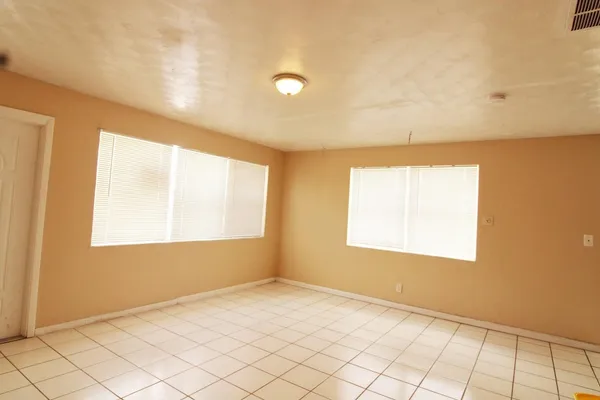 a view of an empty room and window