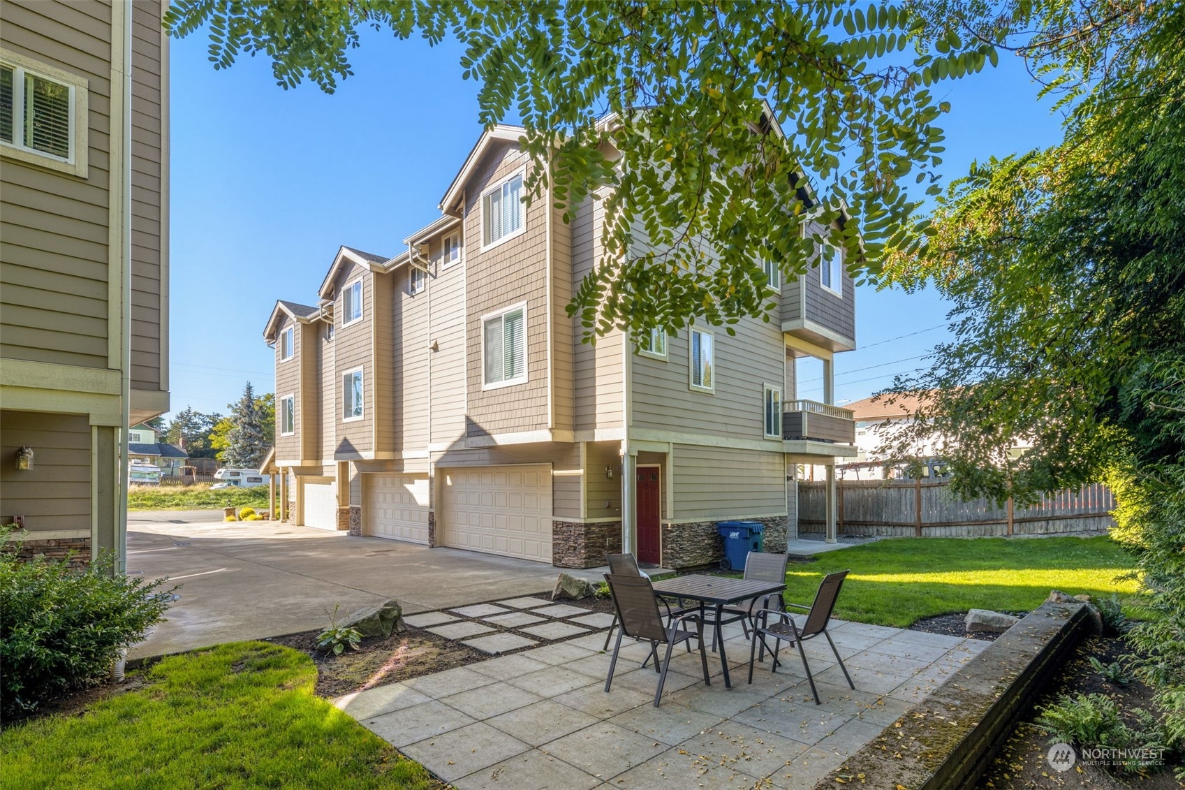 978 Edmonds Avenue Northeast Renton, WA 98056 - Photo 6 of 18 a view of a house with a swimming pool and sitting area