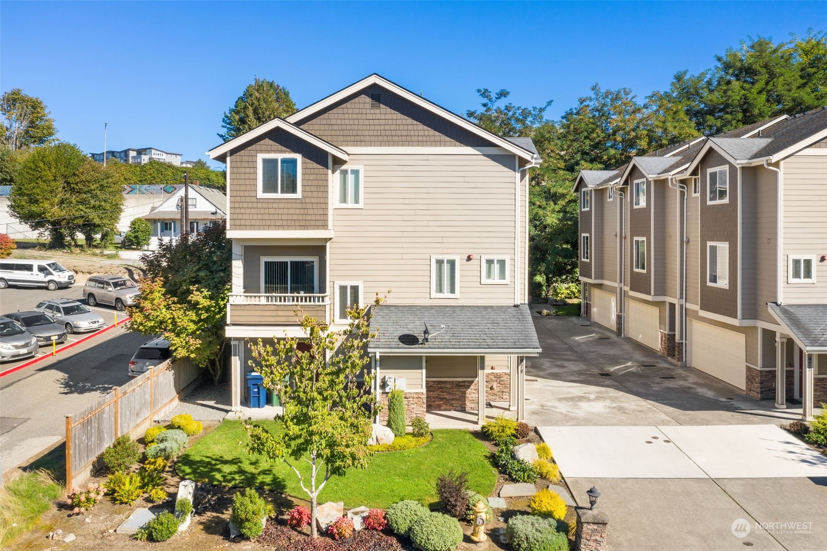 978 Edmonds Avenue Northeast Renton, WA 98056 - Photo 8 of 18 a front view of a house with a yard