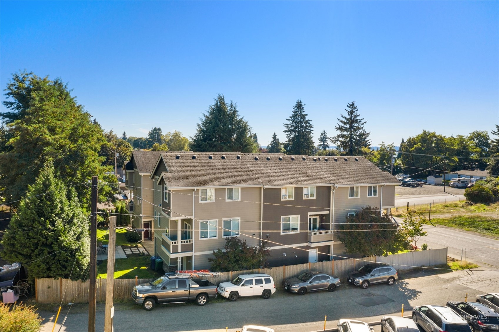 978 Edmonds Avenue Northeast Renton, WA 98056 - Photo 10 of 18 a front view of a house with a garden and balcony