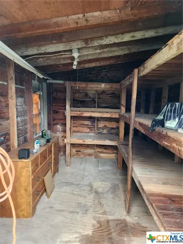 a view of a chair and table in the garden