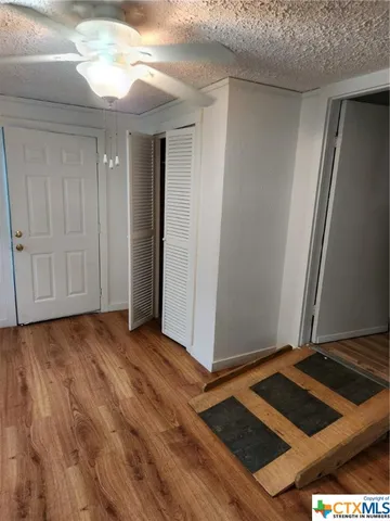 a view of an empty room and window