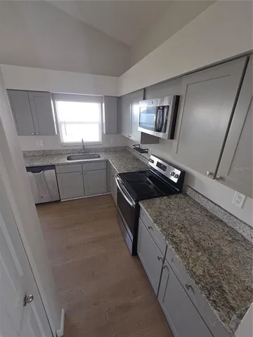 a view of cabinets and wooden floor