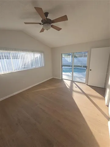 a bathroom with a granite countertop sink and a bathtub
