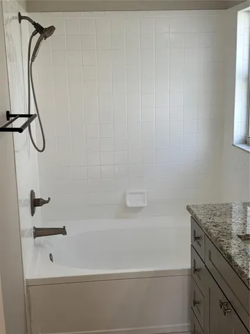 an empty room with a empty space and windows