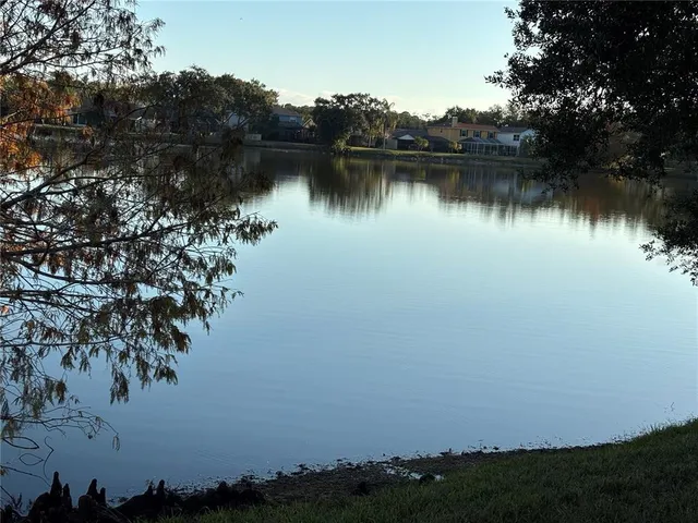 a view of a swimming pool with an outdoor space and seating area