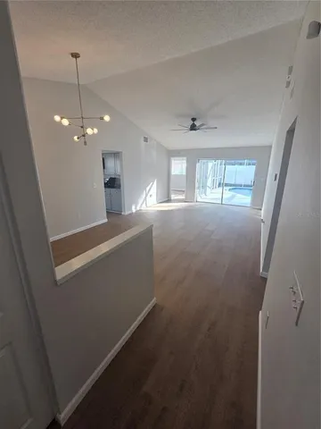 a kitchen with stainless steel appliances granite countertop a refrigerator a stove a sink and dishwasher