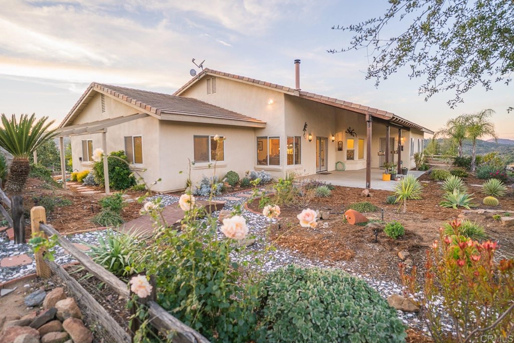 29523 Anthony Road Valley Center, CA 92082 - Photo 1 of 1 a front view of a house with garden
