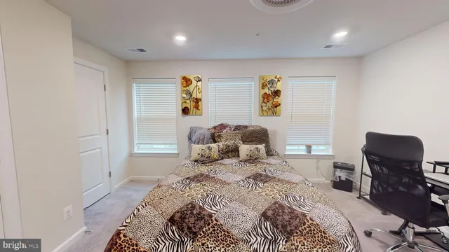 a bedroom with a bed and chair