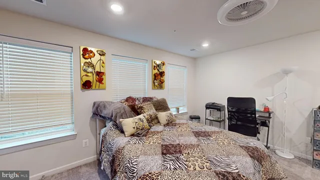 a bedroom with a bed and furniture