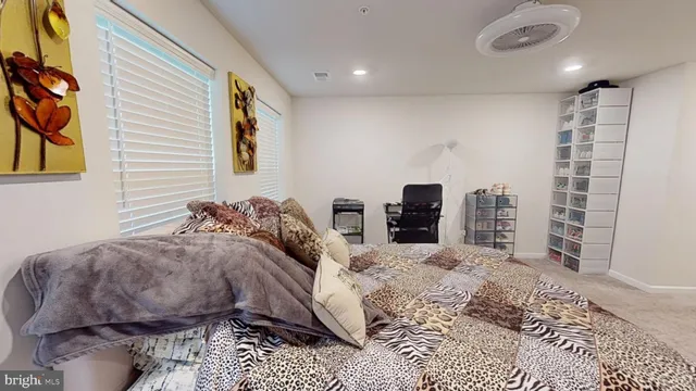 a bedroom with a bed and a television