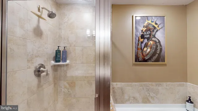 a bathroom with a painting on the wall and a shower