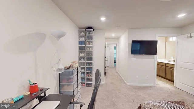 a view of a livingroom with furniture and an empty room