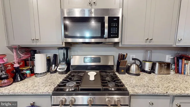 a bedroom with a bed and a bathroom