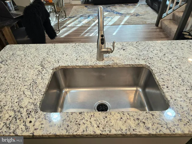 a living room with furniture a couch and a flat screen tv