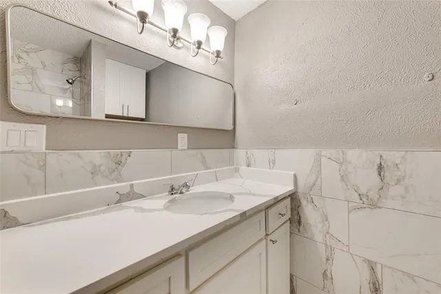 a bathroom with a bathtub and shower