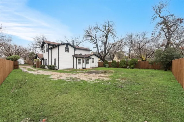 a view of backyard with green space