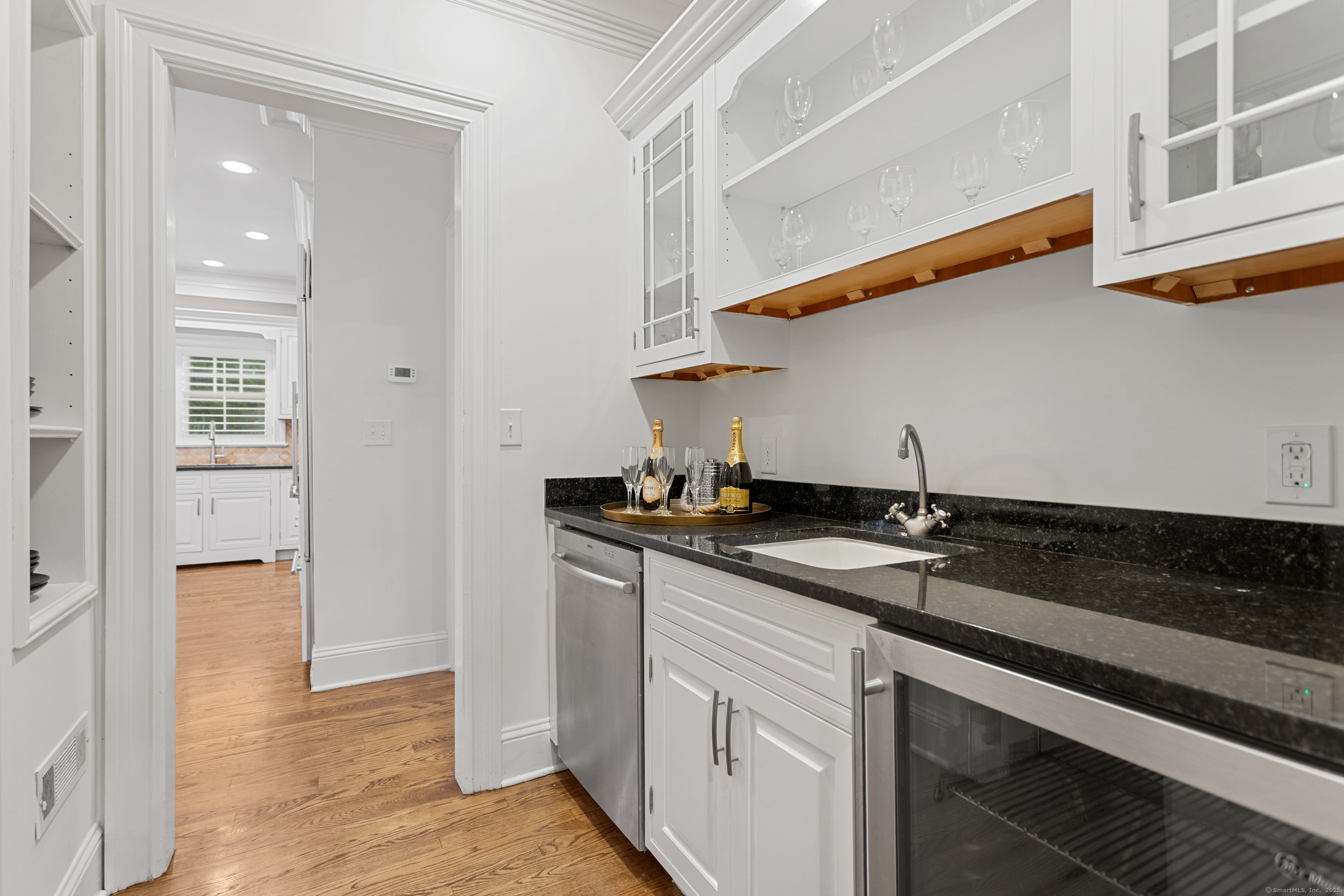 123 Greens Farms Road Westport, CT 06880 - Photo 16 of 40 a kitchen with a sink and a refrigerator