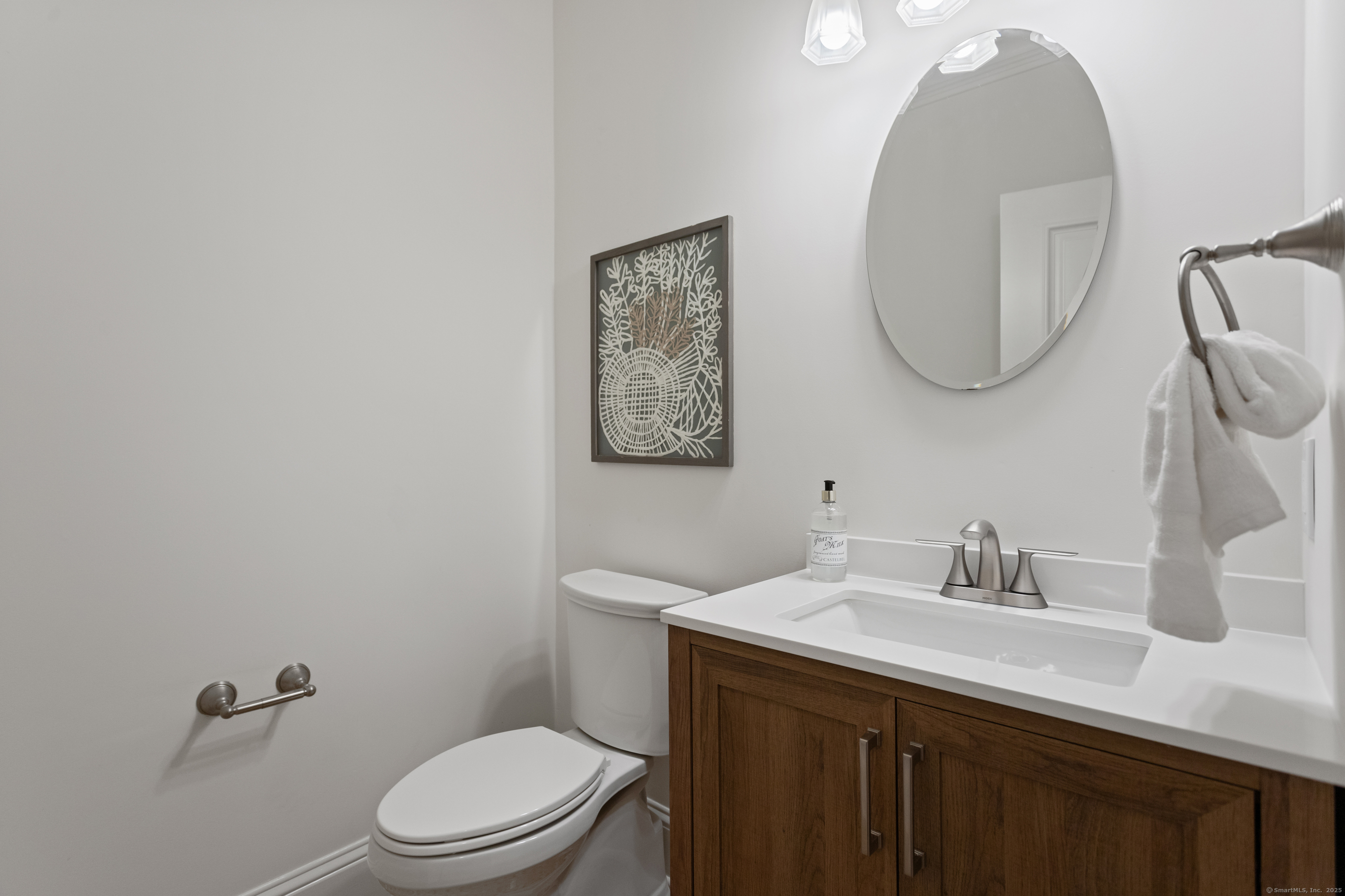 123 Greens Farms Road Westport, CT 06880 - Photo 18 of 40 a bathroom with a toilet a sink and mirror