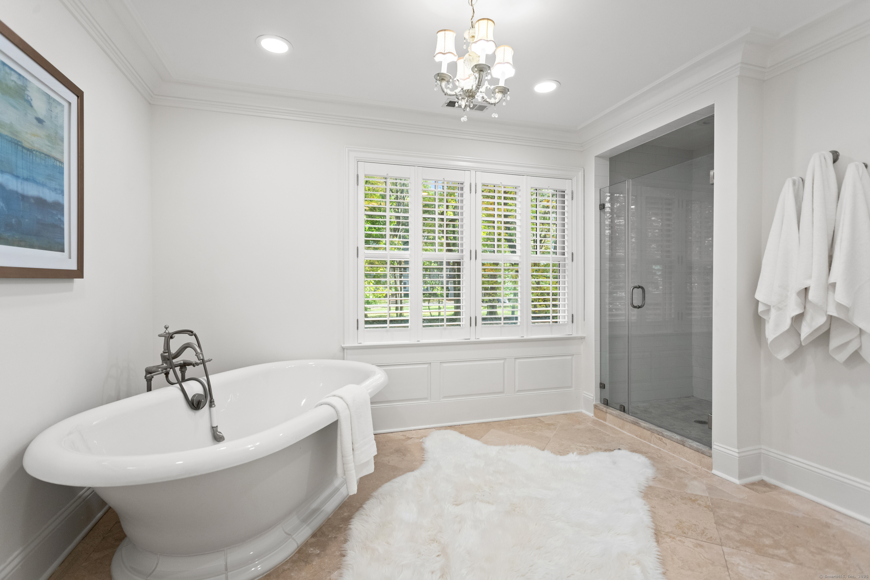 123 Greens Farms Road Westport, CT 06880 - Photo 23 of 40 a white bath tub sitting in a bathroom next to a bathroom sink