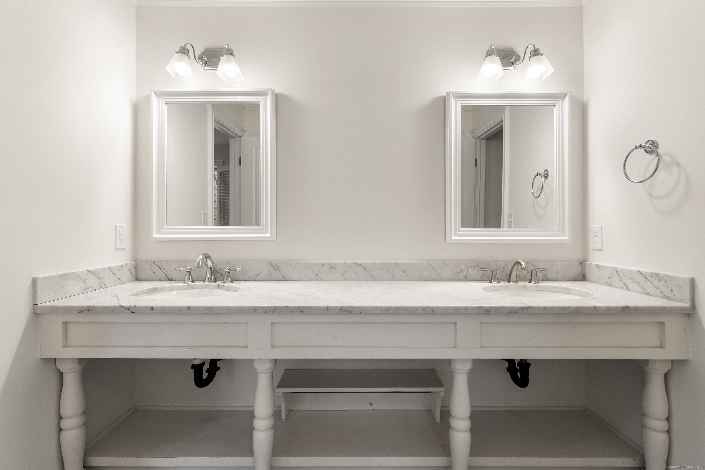 123 Greens Farms Road Westport, CT 06880 - Photo 26 of 40 a bathroom with a sink and a mirror