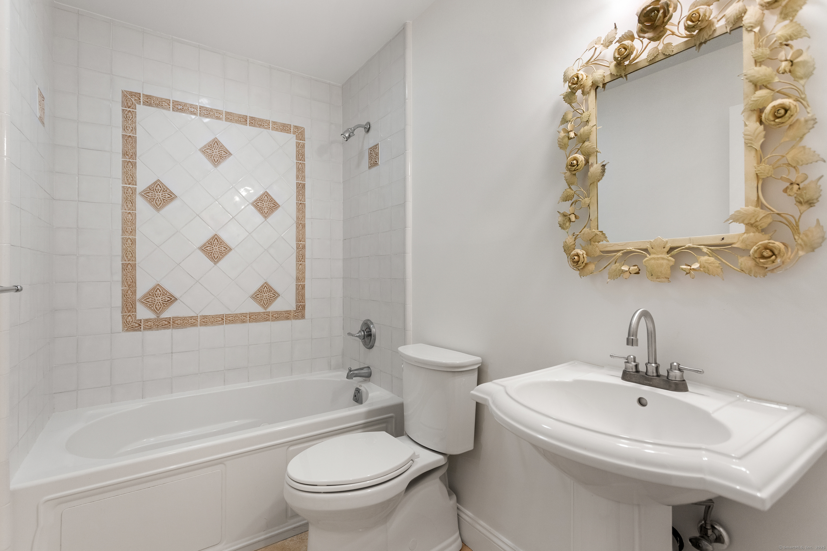 123 Greens Farms Road Westport, CT 06880 - Photo 29 of 40 a white toilet sitting next to a bathroom sink and tub