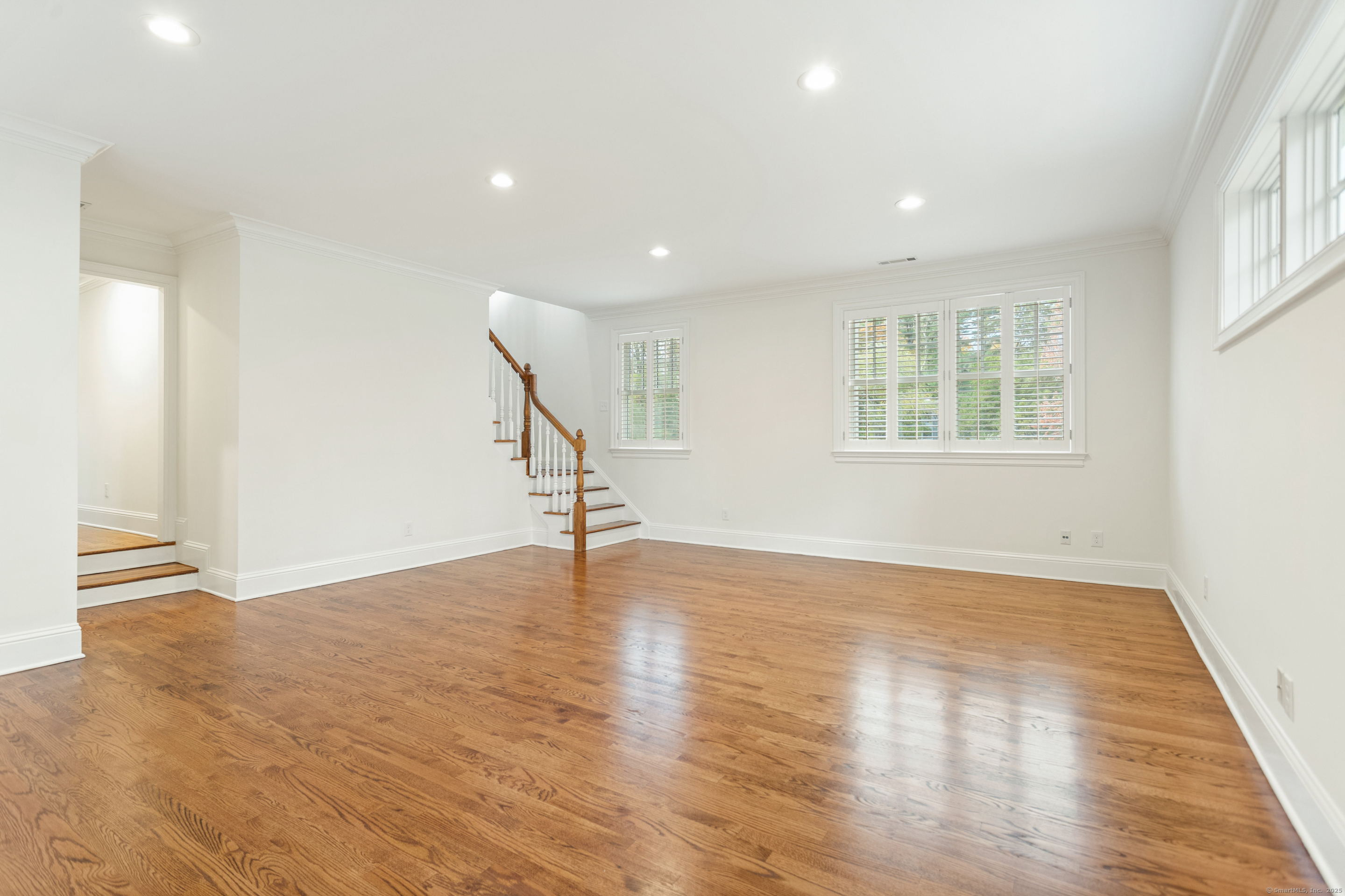 123 Greens Farms Road Westport, CT 06880 - Photo 31 of 40 an empty room with wooden floor and windows