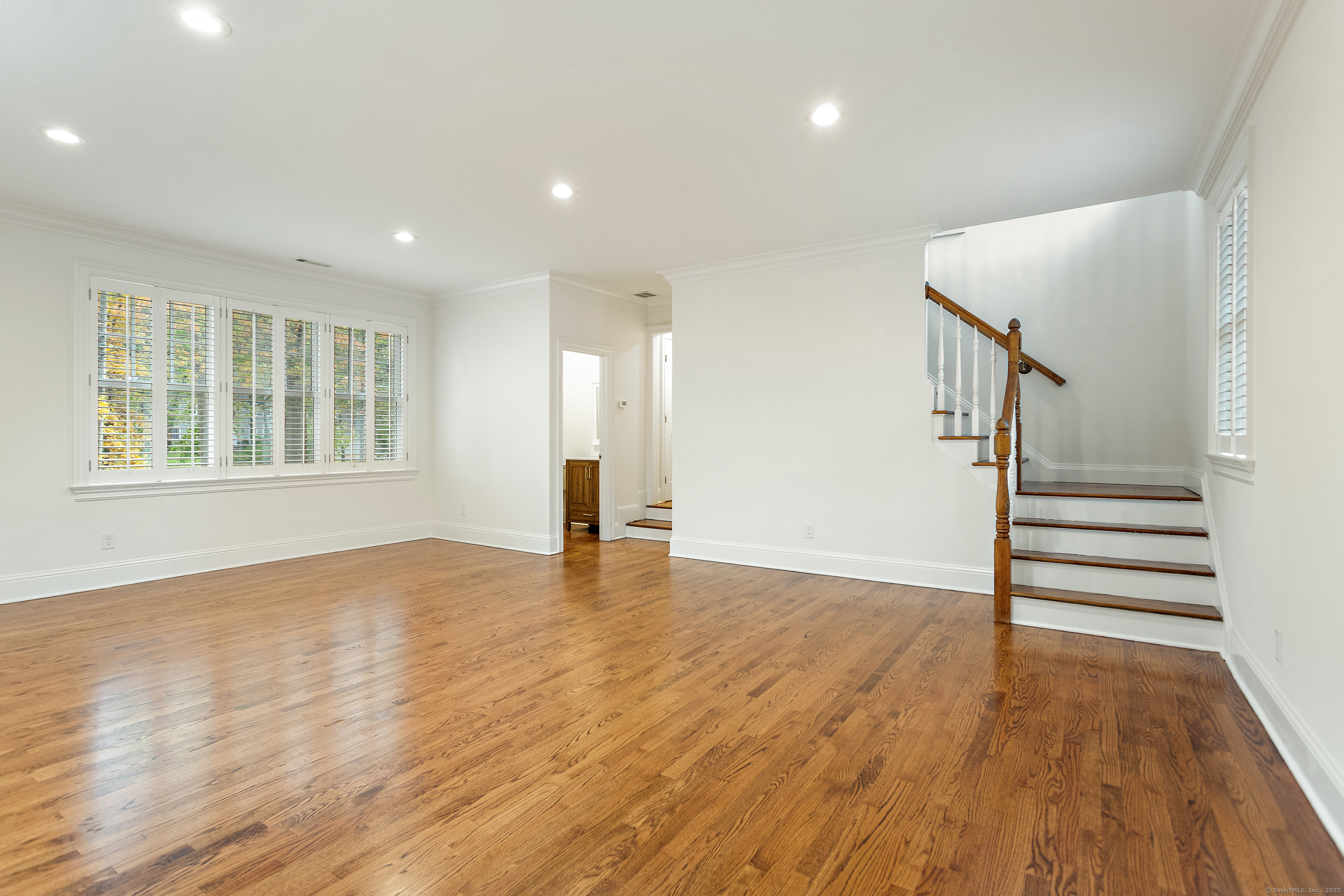 123 Greens Farms Road Westport, CT 06880 - Photo 32 of 40 a view of empty room with wooden floor and fan